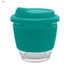A teal reusable coffee cup with a silicone sleeve and lid, made from glass. It features a logo on the side.