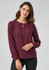 A burgundy long sleeve blouse with a round neckline and keyhole detail, featuring gathered sleeves.