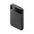 A black power bank with two USB ports and a digital display indicating battery percentage. It features a logo.