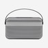 A premium wireless speaker in silver and black with a carrying handle and a sleek design.