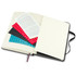 An opened Moleskine 2026 Daily Planner with blank pages, featuring colourful stickers and a black ribbon bookmark.