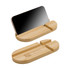 A bamboo phone stand in a curved design, featuring a logo and a sleek black surface for holding phones.