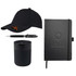 A black cap, black pen, black candle, and black notebook, all featuring branding elements.