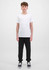 A pair of black track pants for youth, paired with a plain white t-shirt and black shoes.