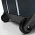 A dark green wheeled suitcase with smooth black wheels and a sleek design. It features silver accents.