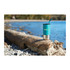 A drink bottle, turquoise with a stainless steel base and straw, placed on a log by the water's edge.