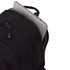 A black backpack with multiple zippered compartments, featuring a laptop partially visible from one of the openings.