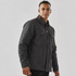 A men's dark grey canvas jacket with a Sherpa lining and two front pockets, featuring a button-up design and a logo.