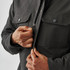 A men's dark grey oxide sherpa-lined canvas jacket with front pockets and a zipped closure.