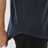 A navy blue short sleeve knit shirt with a curved hem and a small logo tag on the side.