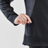 A navy blue women's knit jacket featuring a zippered pocket and a sleek, comfortable design. It includes a logo.
