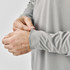 A grey Men's Monterey 1/4 Zip Pullover displayed with focus on the wrist and cuff detail. It features a logo.