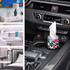 A colourful tissue dispenser with a geometric design, placed in a car's cup holder among various home settings.