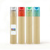 A tube containing long pencils with transparent caps in red, green, and blue, along with a natural kraft exterior.
