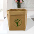 A large brown kraft paper storage bag featuring a green logo of a tree and leaves, placed on a table.