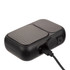 A black Bluetooth speaker with a textured grille and charging port, featuring a sleek, compact design.