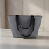 A grey lunch bag with black handles, featuring a spacious design and a sturdy build.