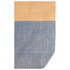 A textured tote bag featuring light brown and blue hues, with a woven pattern and a branded logo.