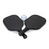 Two black pickleball paddles and a white perforated ball, arranged together. The paddles have grips and a logo.