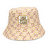 A pink and yellow patterned bucket hat featuring an embroidered patch. The design includes heart shapes and has a logo.