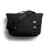 A black messenger bag with a flap, adjustable shoulder strap, and branding label. It features buckle closures and a sleek design.