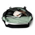 A black and mint green messenger bag opened to reveal multiple compartments, including a laptop sleeve and pouches.