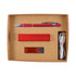 A red pen, red USB drive, and a charging cable arranged in a cardboard gift box. The box has a logo.