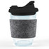 A reusable coffee cup with a clear body, black snap lid, and a gray RPET band for insulation.