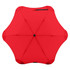 A red BLUNT Metro Umbrella with a unique design and a central button, featuring a logo on it.