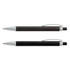 Two metal pens are displayed: one with a black rubber grip and silver accents, and the other entirely in black. Both have branding.