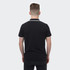 A black polo shirt with contrasting trim, featuring a small logo on the back.