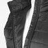 A black puffer vest featuring a zip front, with a close-up view of the collar and stitching details.