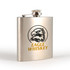 A stainless steel hip flask featuring a circular eagle design and a logo, finished in a polished metallic colour.