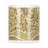 A ceramic mug featuring a decorative pattern in earthy tones of brown, orange, and cream. It comes in a box.