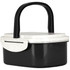 A plastic and wheat straw lunch box in black and white with a handle and a secure lid. It features a logo.