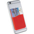 A slim red silicone card wallet attached to the back of a silver phone, holding a card securely in place.