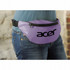 A purple bum bag worn around the waist, featuring a large logo, set against a textured background.