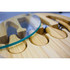 A bamboo cheese board featuring a glass top and compartments for cheese knives. The board has a natural wood finish.