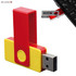 A red and yellow USB flash drive with a plastic clip, 32GB capacity, alongside a smartphone keyboard.