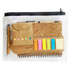A transparent pouch containing a cork notebook, sticky notes in various colours, a pen, and a small envelope.