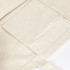 A cream-coloured canvas tote bag featuring a zippered pocket on the front. It has a simple, unembellished design.