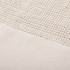 A textured beige mesh fabric, featuring a woven pattern at the top and a solid section at the bottom.