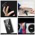 A black car vent phone holder ring, displayed with a smartphone, featuring a sleek design and a logo.