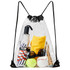 A clear drawstring backpack contains an umbrella, clothing, sunglasses, a tennis ball, and various personal items.
