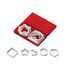 A set of white cookie cutters in various shapes, housed in a red storage case.