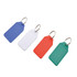 A selection of four key tags in blue, white, red, and green, each with a silver keyring attachment.