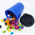 A drink bottle in blue with a black lid, surrounded by colourful jelly beans in various shapes and sizes.