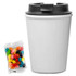 A drink bottle in white with a black lid, accompanied by a pack of assorted jelly beans.