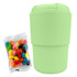 A mint green reusable coffee cup with a textured grip, accompanied by a pack of colourful jelly beans.