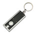 A keyring torch featuring a sleek black and silver design with a circular button and a keychain attachment.